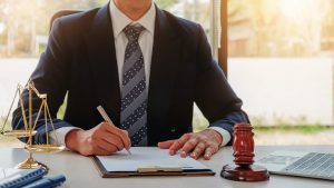 Attorney Signing A Document Stock Photo