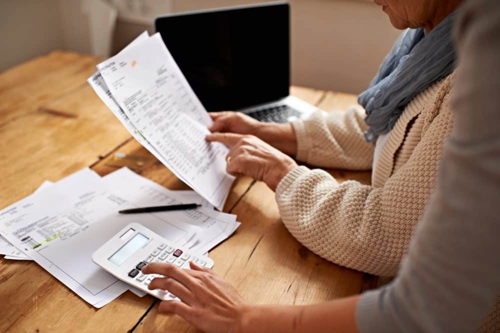 A woman in Odessa going over her car accident settlement information.