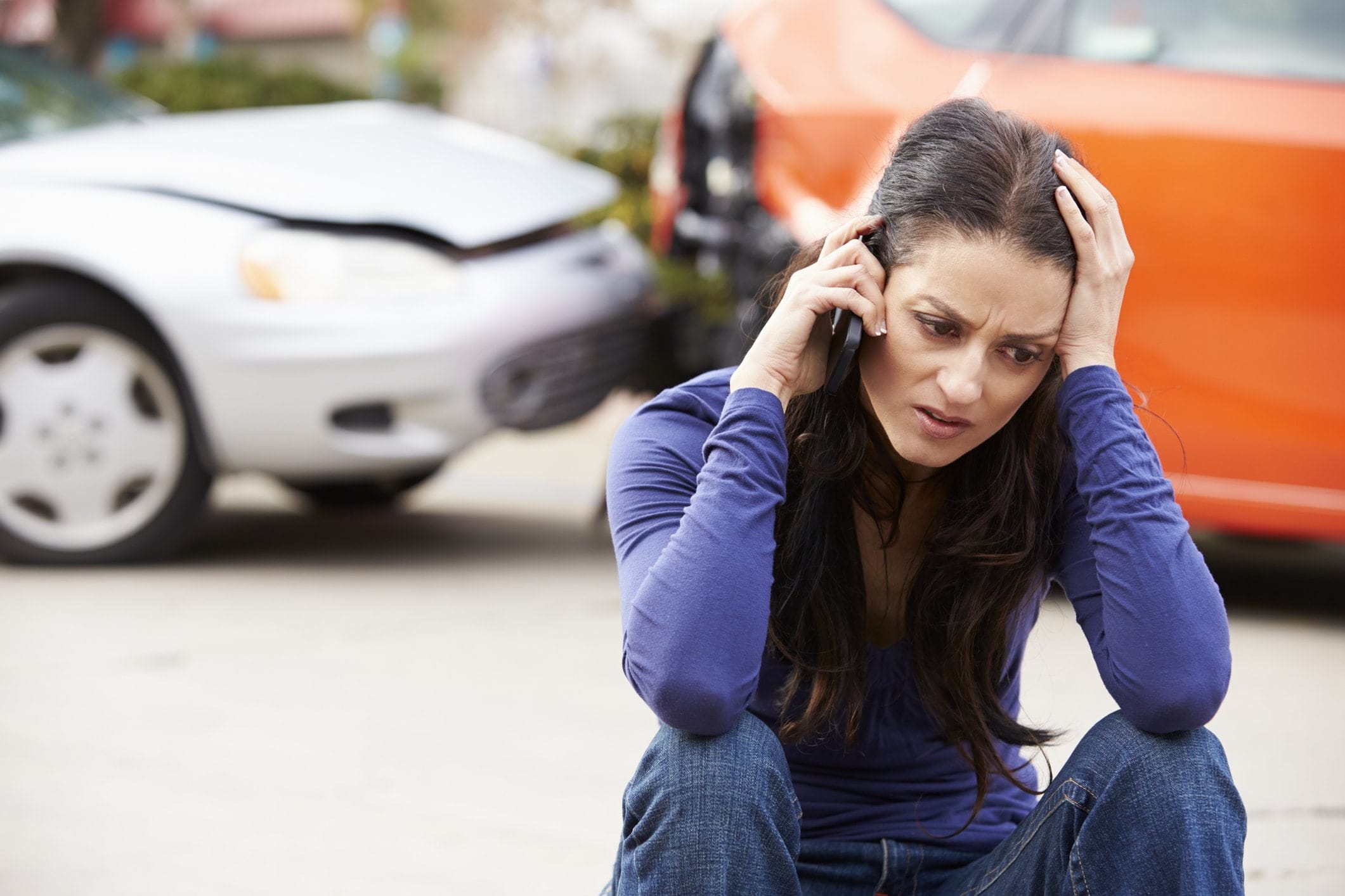 A woman calling her insurance company after an Odessa, TX, car accident.